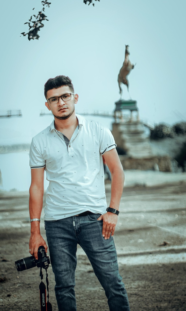 “Professional photographer standing with camera”